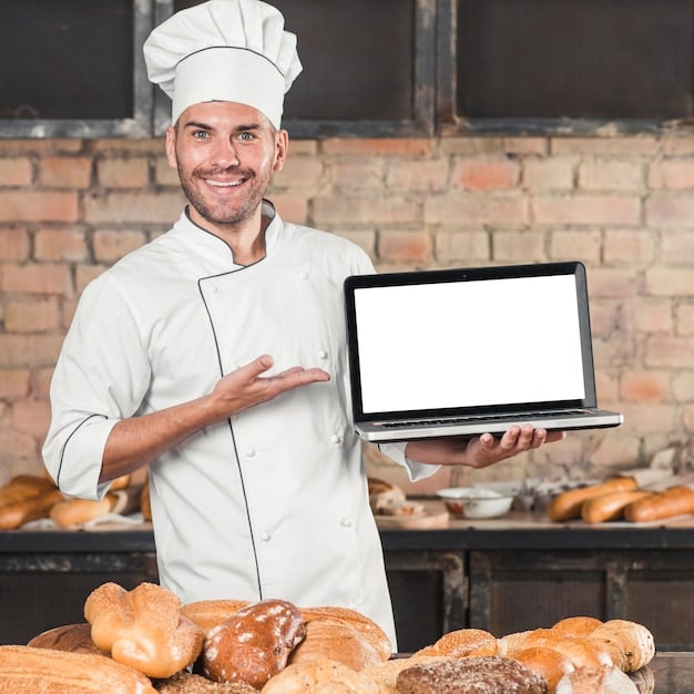 Smiling male baker standing in front of table with different type of ...